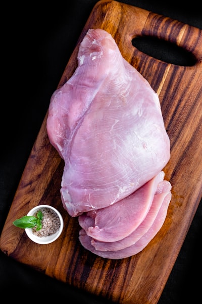 Fresh chicken meat on a cutting board